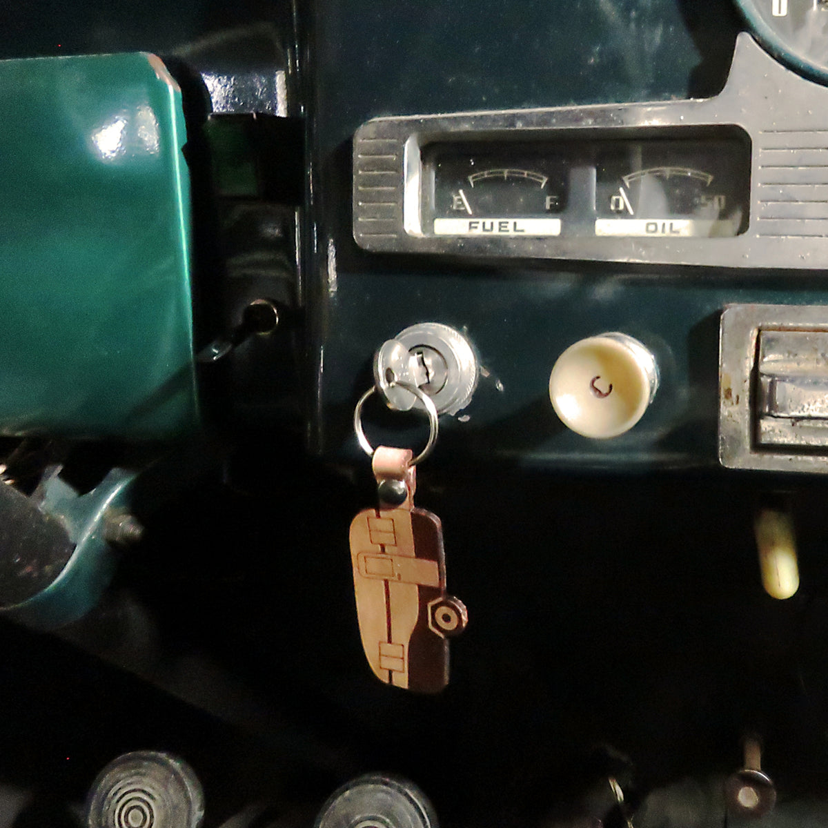 Close-up of a vehicle's dashboard with a key inserted into the ignition.