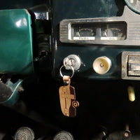 Close-up of a vehicle's dashboard with a key inserted into the ignition.