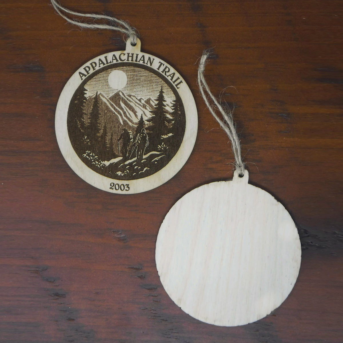 Ornament with 'Appalachian Trail' design on a wooden surface
