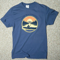 Blue t-shirt with New Hampshire graphic on a textured surface