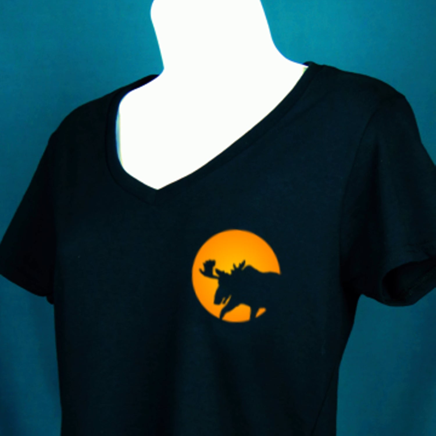 Black t-shirt with orange graphic of a moose and moon on a blue background