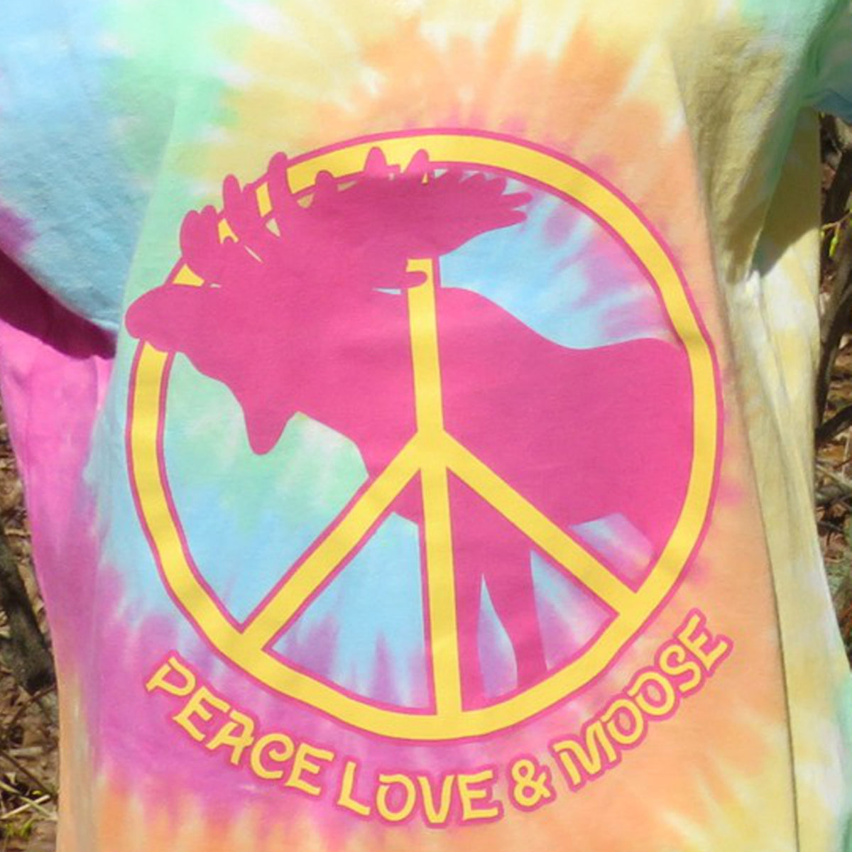 Tie-dye shirt with peace symbol and 'Peace Love & Moose' text on a natural background