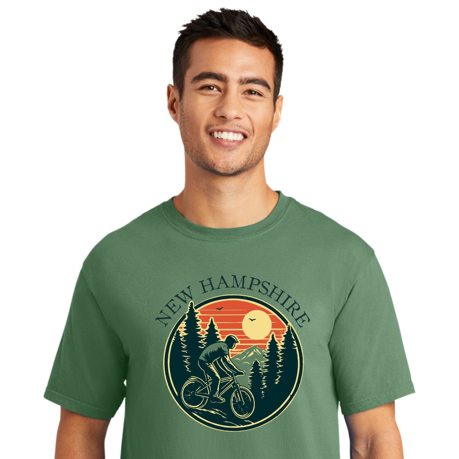 Man wearing a green t-shirt with New Hampshire graphic design on a white background