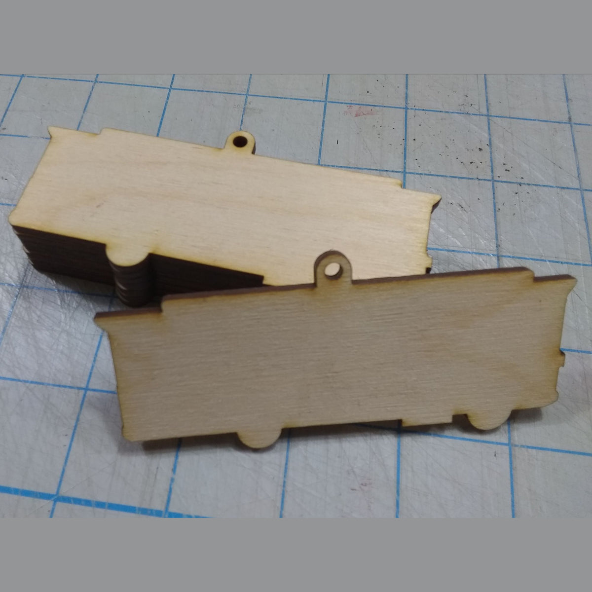 Wooden toy truck model on a grid background