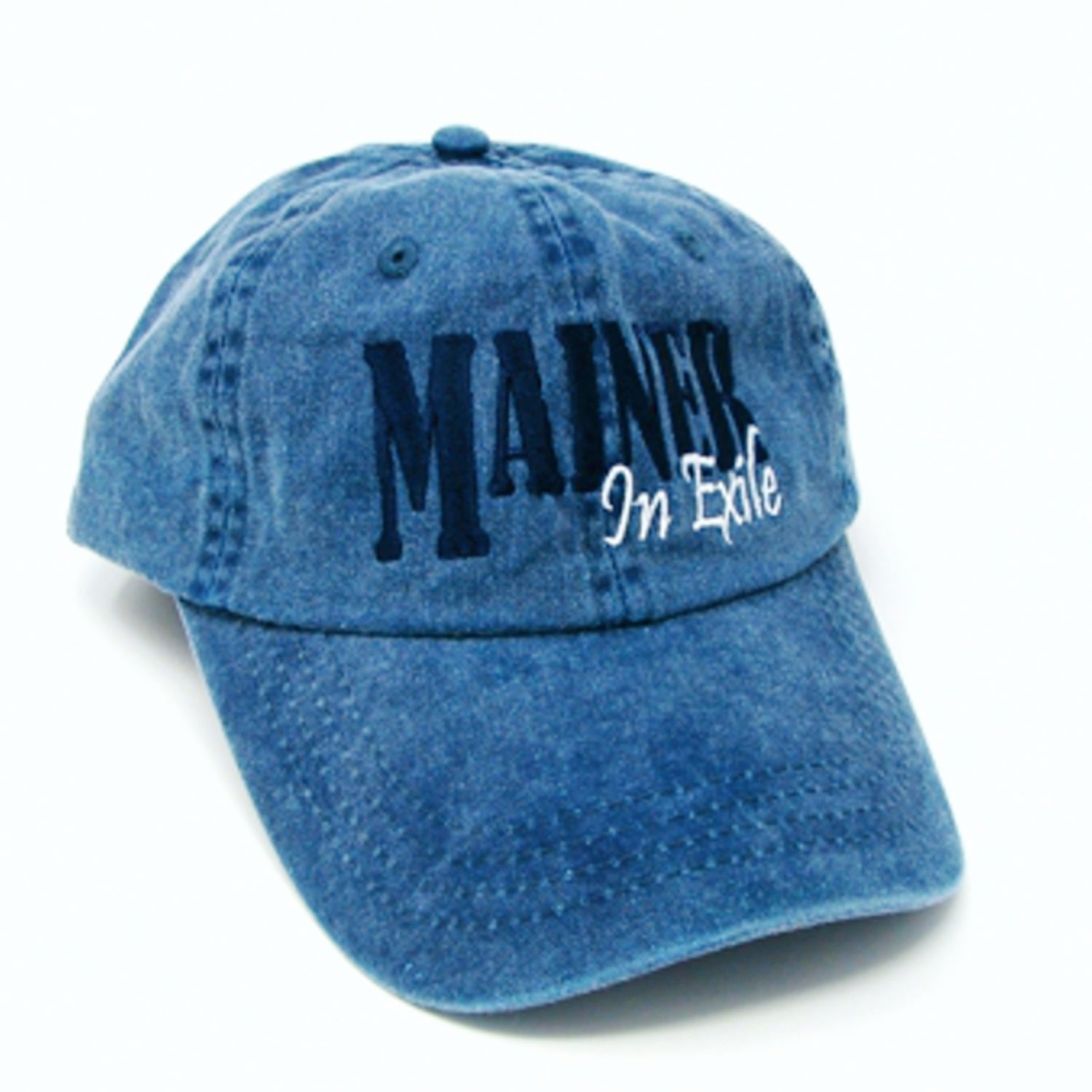 Blue denim cap with 'Maine In Exile' text on a white background