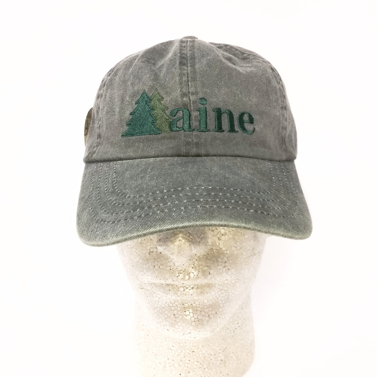 Green cap with 'Maine' and a tree logo on a white background