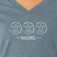 Blue V-neck shirt with sand dollar design and 'MAINE' text.