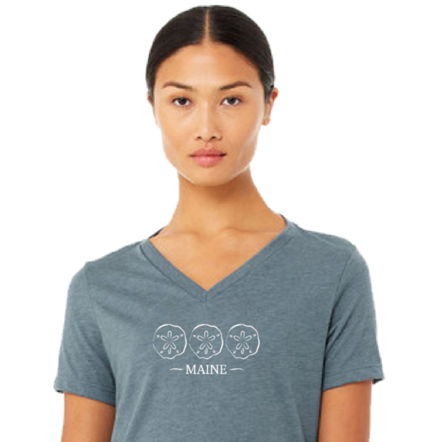 Woman wearing a blue V-neck t-shirt with 'MAINE' and sand dollar designs on a white background