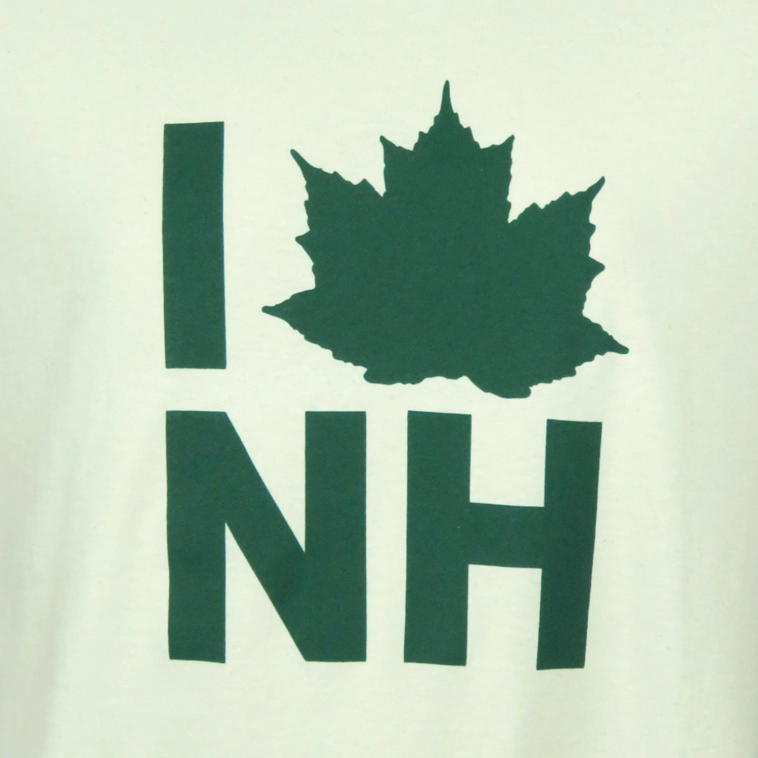 Green 'I love NH' design with a maple leaf on a white background