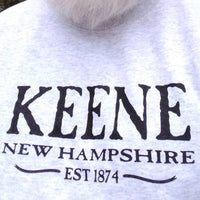 Grey sweatshirt with 'KEENE NEW HAMPSHIRE EST 1874' text on a white background