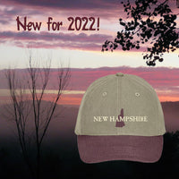 New Hampshire cap with a scenic background