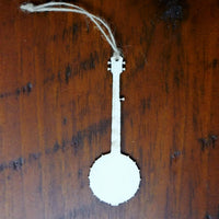 White banjo ornament on a wooden surface