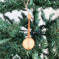 Banjo-shaped Christmas ornament hanging on a tree