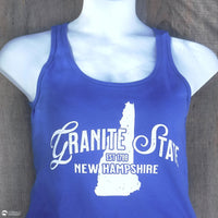 Blue tank top with 'Granite State New Hampshire' text on a mannequin against a wooden background
