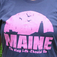Blue t-shirt with pink 'MAINE The Way Life Should Be' graphic design.